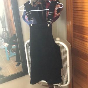 Overall black. Corduroy